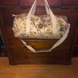 Like new NIXON large duffel bag with shoulder strap foliage print
